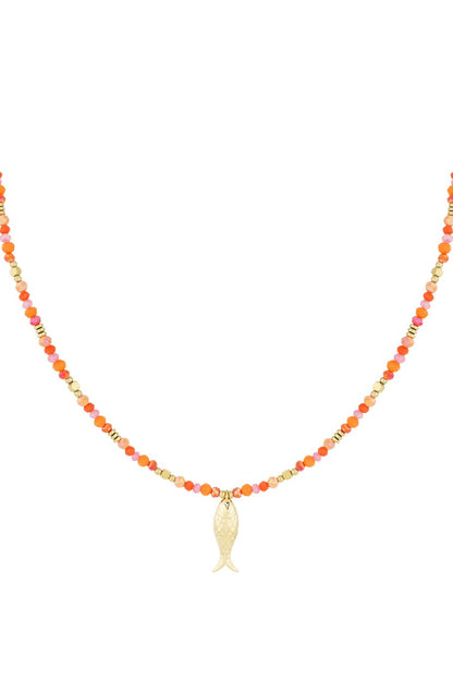 Gold-plated fish charm beaded necklace on white background 